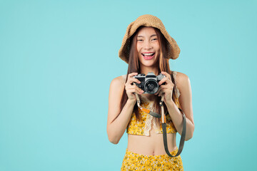 Happy smiling asian tourist woman big smile excited young travel hold camera wearing summer floral...
