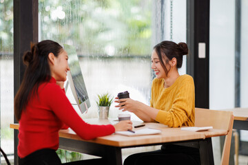 Financial team Business women analyze the graph of the company's performance to create profits and growth, Market research reports and income statistics, Financial and Accounting concept.	
