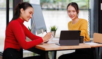 Financial team Business women analyze the graph of the company's performance to create profits and growth, Market research reports and income statistics, Financial and Accounting concept.	
