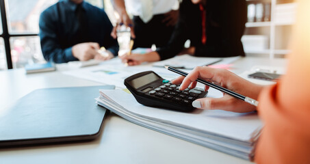 The financiers are calculating personal taxes for their customers.