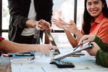 Brainstorming of young modern group. Team meeting to achieve goal. Business people discussing finance business and analysis. Teamwork concept in modern office. Calculating personal tax for client.