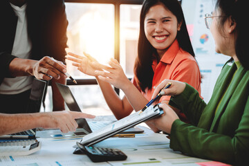 Brainstorming of young modern group. Team meeting to achieve goal. Business people discussing finance business and analysis. Teamwork concept in modern office. Calculating personal tax for client.