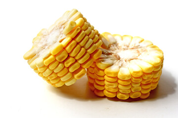 Sliced yellow corn on a white background.