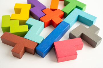 Logical thinking and problem solving creative business solution concept, wooden puzzle geometric shape block shape.