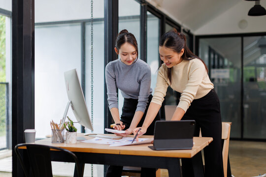 Team of Asia businesspeople talk ESG strategies risk management workshop, SDGs report, global warming, green finance investment eco friendly and net zero waste in boardroom training building.
 - Powered by Adobe