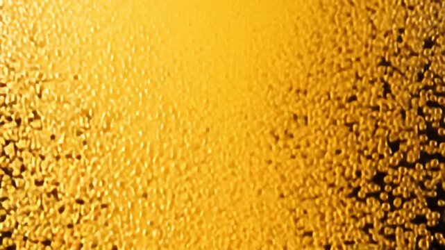 Golden lager beer being poured, creating a thick, frothy head as countless bubbles rise continuously and effervescently through the liquid. 