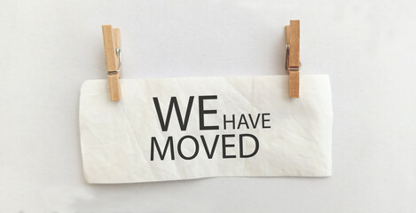 we have moved sign on white background	
