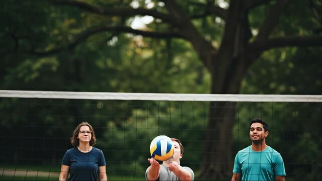 Young man with down syndrome playing volleyball with friends in park. Inclusive sports and active lifestyle. Teamwork, friendship and recreation concept for banner - Powered by Adobe