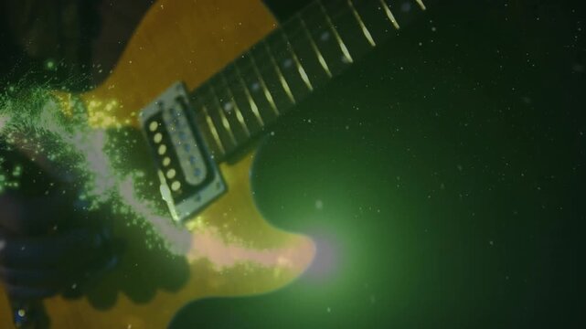 Right hand plucking chord causing green glow swirling ring spiraling up guitar neck to show energy