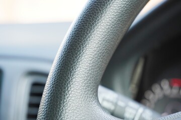 Steering wheel in a car. Black steering wheel in the car closeup