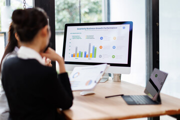 Business people group meeting in the office . Profession asian business women office workers working in team conference with project planning document on meeting table .
