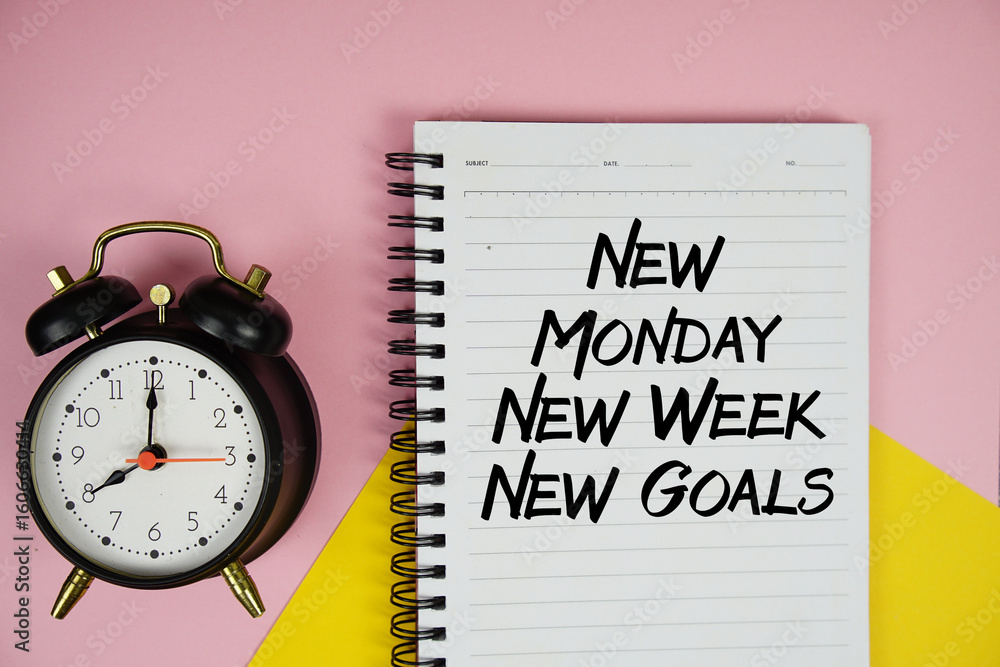 Poster new monday new week new goals text written on notepad with alarm clock on pink background