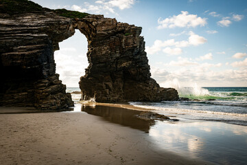 waves splashes at Playa de las Cathedrales in Galicia in Spain