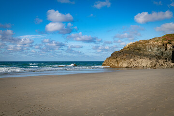 playa de cathedrales Beach With Clear Sky and Rolling Waves Near Rocky Cliff