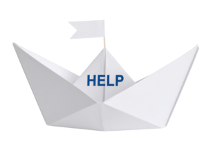 A white paper boat with a small flag and the word "HELP" printed on its sail.