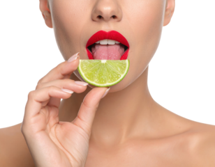 A close-up of a woman with red lipstick about to lick a fresh lime slice, set against a black background.