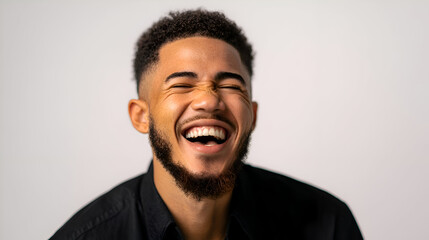 Joyful Man Laughing Out Loud, Showing Teeth, Against White Background
