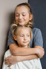 Cheerful children little girl and boy together at home. Sibling indoor, childhood concept