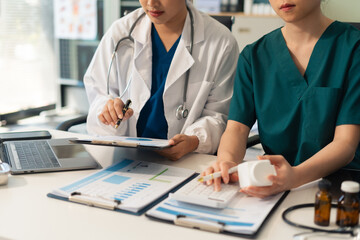 Doctors use a service fee calculator to save money on health insurance, drug cost concepts.