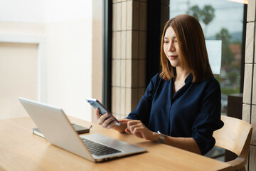 lifestyle of office workers, Woman calculating expenses and using laptop. Work place. Lifestyle.