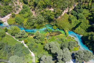 The Blue eye, turquoise river with a karst spring a natural phenomenon in the mountains of southern Albania near Sarande.