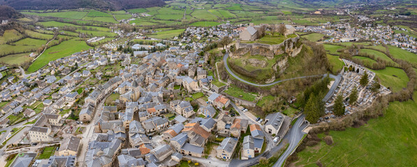 Aerial panorama view of the city Sévérac-d'Aveyron in France on a sunny autumn day	