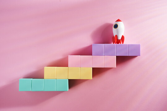 Business or career growth. staircase with toy rocket