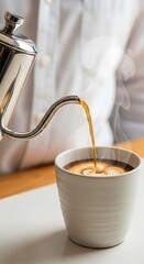 Coffee being poured into a mug.