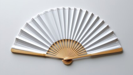 A traditional white paper fan with a wooden handle spread open