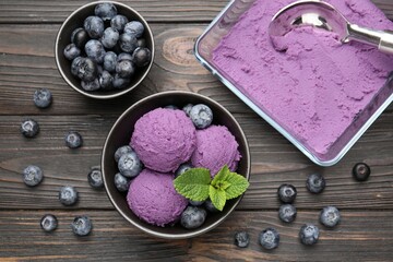 Tasty sorbet with blueberries and mint on wooden table, flat lay