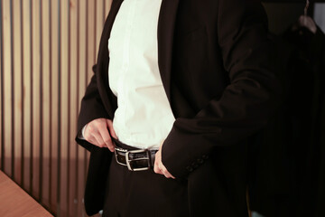 Man in elegant outfit getting ready indoors, closeup