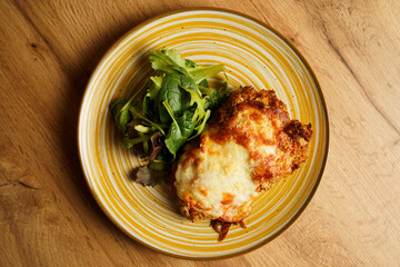 Crispy chicken parmigiana with salad