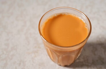 Cha thai ,Thai milk Tea, Traditional Thai tea with sweetened condensed on grey background