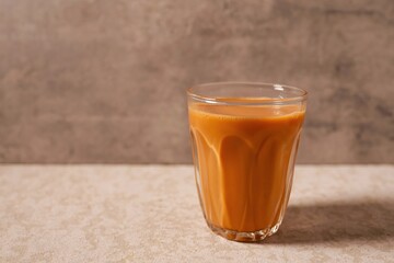 Cha thai ,Thai milk Tea, Traditional Thai tea with sweetened condensed on grey background