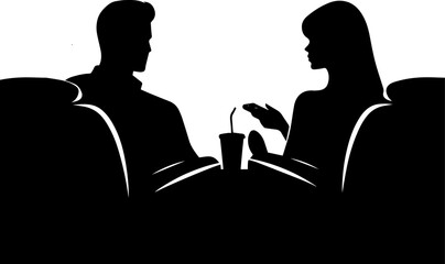Man and woman talking while sitting at a table in a café  