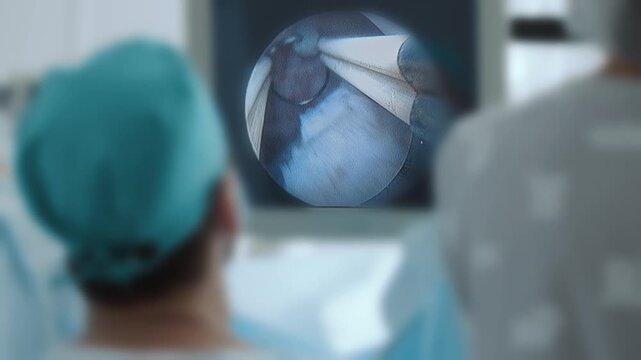 Male laparoscopy procedure for prostate adenoma in surgical setting.
