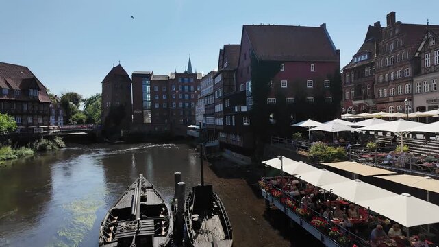 View of Stintmarkt the old harbor with the old crane in Luneburg city, Germany