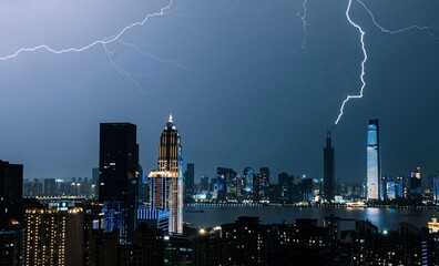 City skyline with lightning at night.