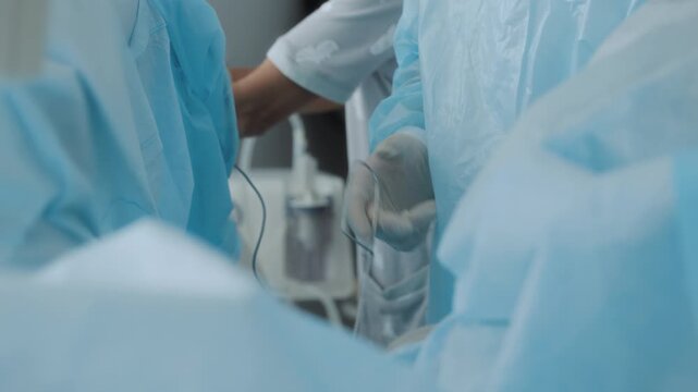 Doctor Installation of catheter stand in bladder to drain urine after surgery to remove stones or prostatitis.