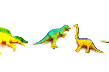 Plastic dinosaur toys on white background