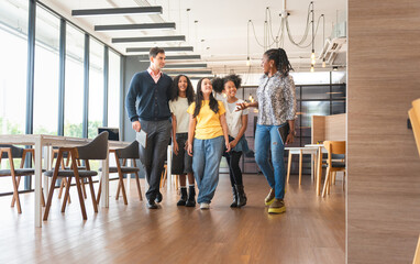 Diverse Group of Mentors and Students Walking and Talking in a Modern Space, Adult Professionals...