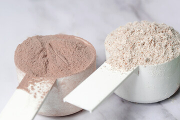 Plastic measuring scoop with protein powder