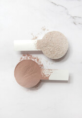 Plastic measuring scoop with protein powder