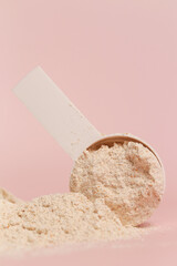 Plastic measuring scoop with protein powder