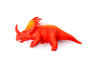Plastic dinosaur toy on white background