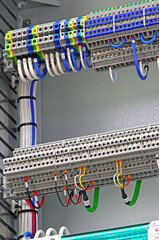 Electrical terminals with connected insulated copper wires with metal lugs. Marking with a thermal...