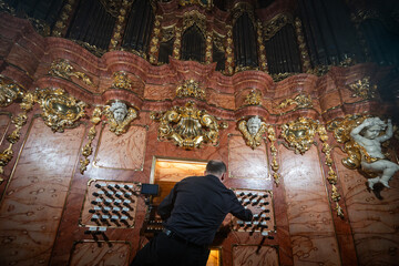 A pianist playing on an antique church organ