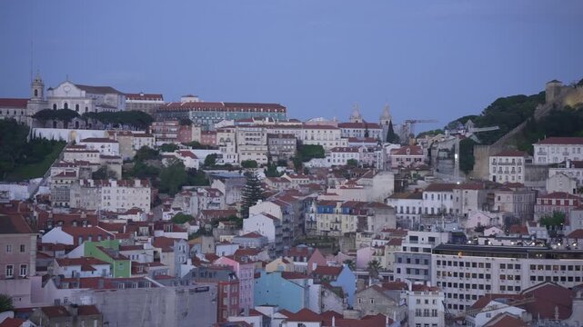 Panoramic view of Lisbon and castle from Miradouro de SALo Pedro de AlcA?ntara at dusk, Lisbon, Portugal, Europe
