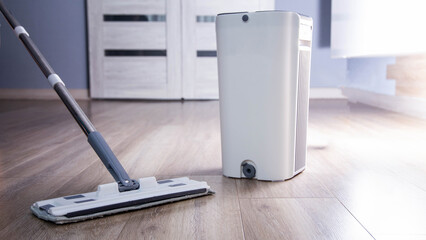 Modern mop with wringer and bucket for easy cleaning, industry. Copy space for text, antistatic