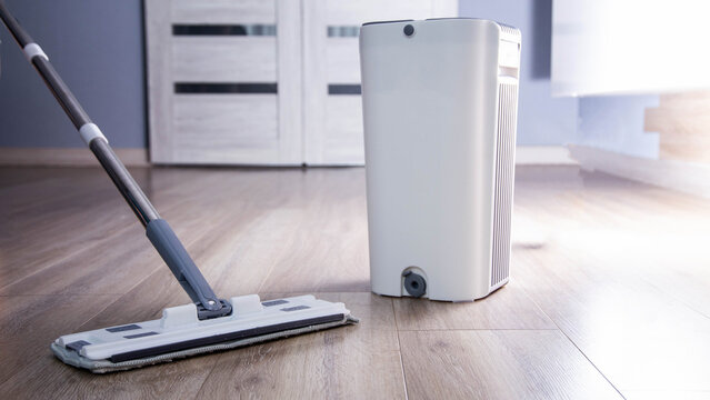 Modern mop with wringer and bucket for easy cleaning, industry. Copy space for text, antistatic